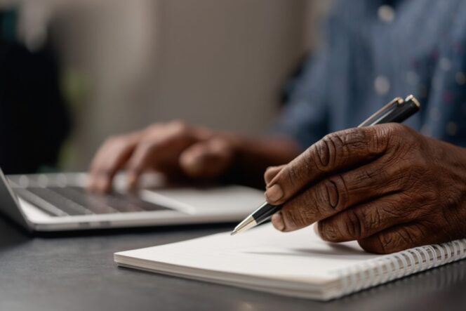 
					Ilustrasi Petani desa sedang menulis